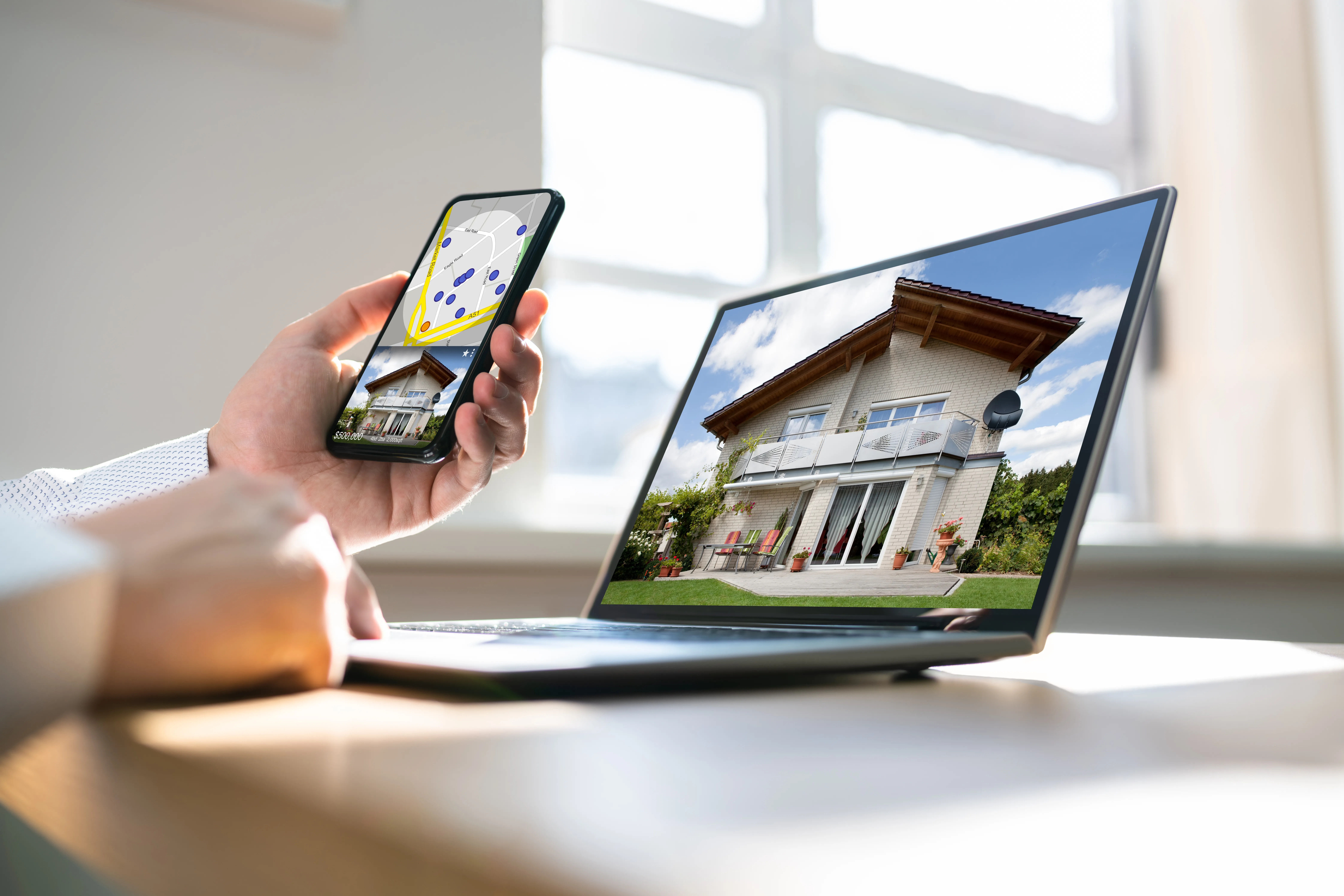 Buyer reviews a home listing online, comparing photos and location before scheduling a showing